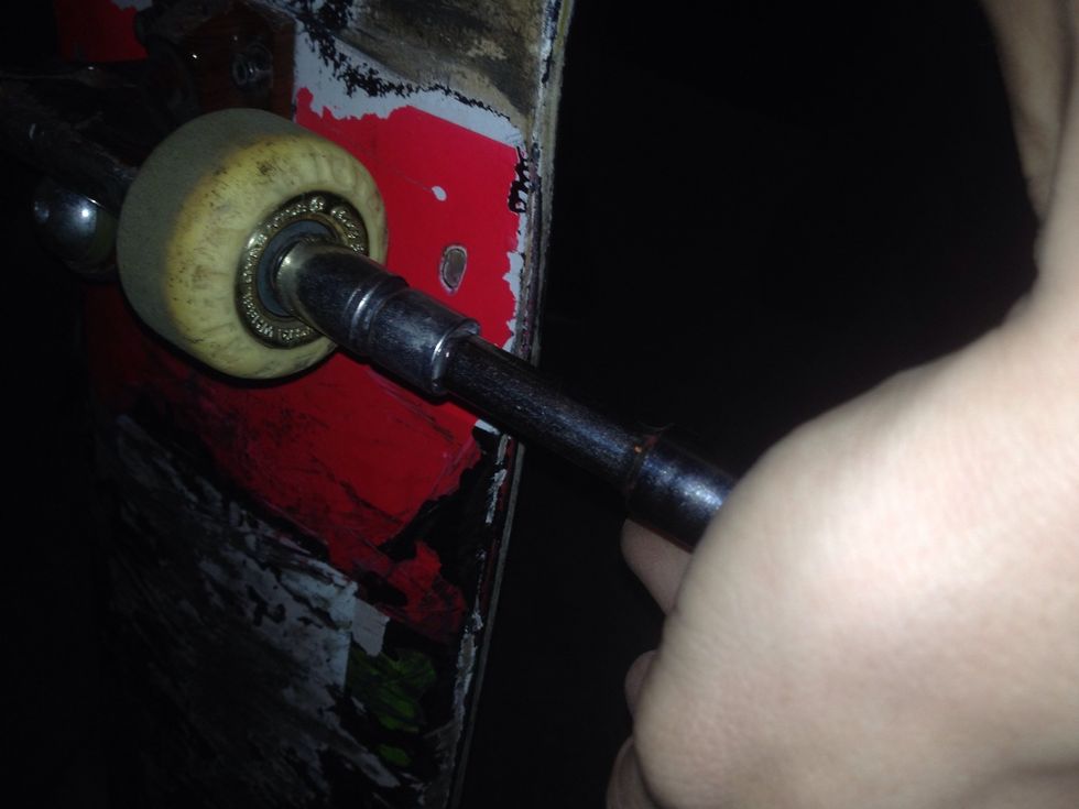 Step 6- Insert the wheels onto the trucks, place a small washer on the outside of the wheel so that the bolt won't tighten too close. Tighten the bolt tight enough that the wheel can still spin freely