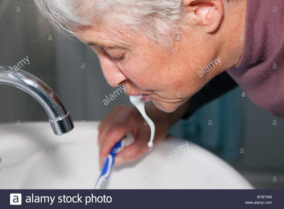 step.6:next put down your tooth brush and spit out your tooth paste.