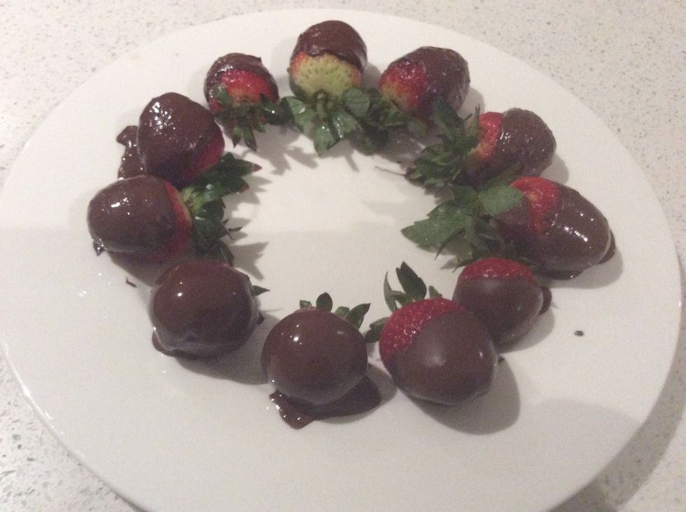 Step 6: once chocolate has completely melted dip the strawberries into the melted chocolate and lay them out on a plate, wait for them to set and enjoy!