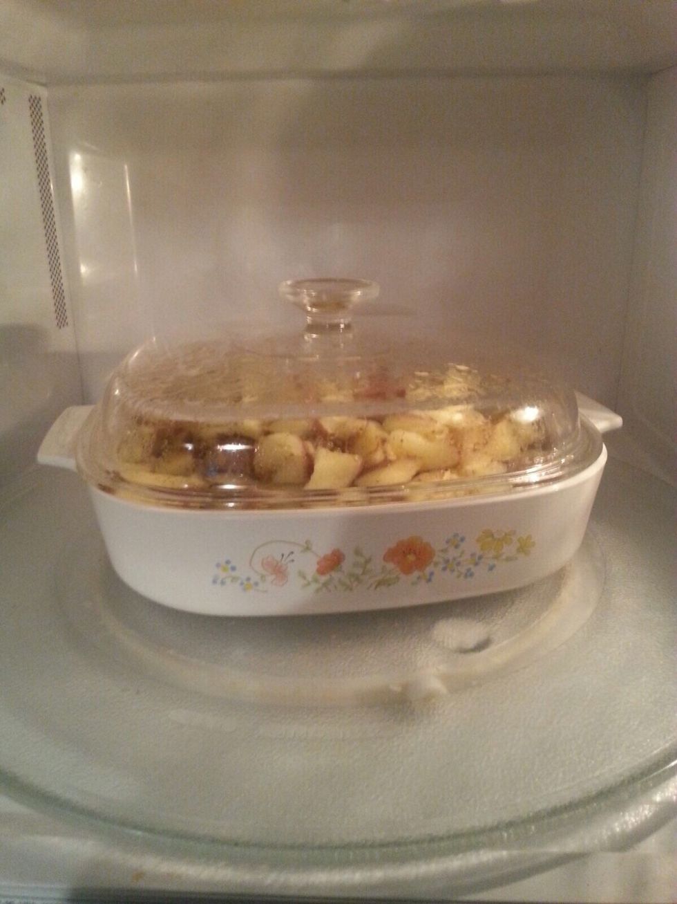 Step 6: once it's done, open the microwave door and use pot-holders to hold the handles of the dish and shake it around. Be sure to hold down the lid while you do this