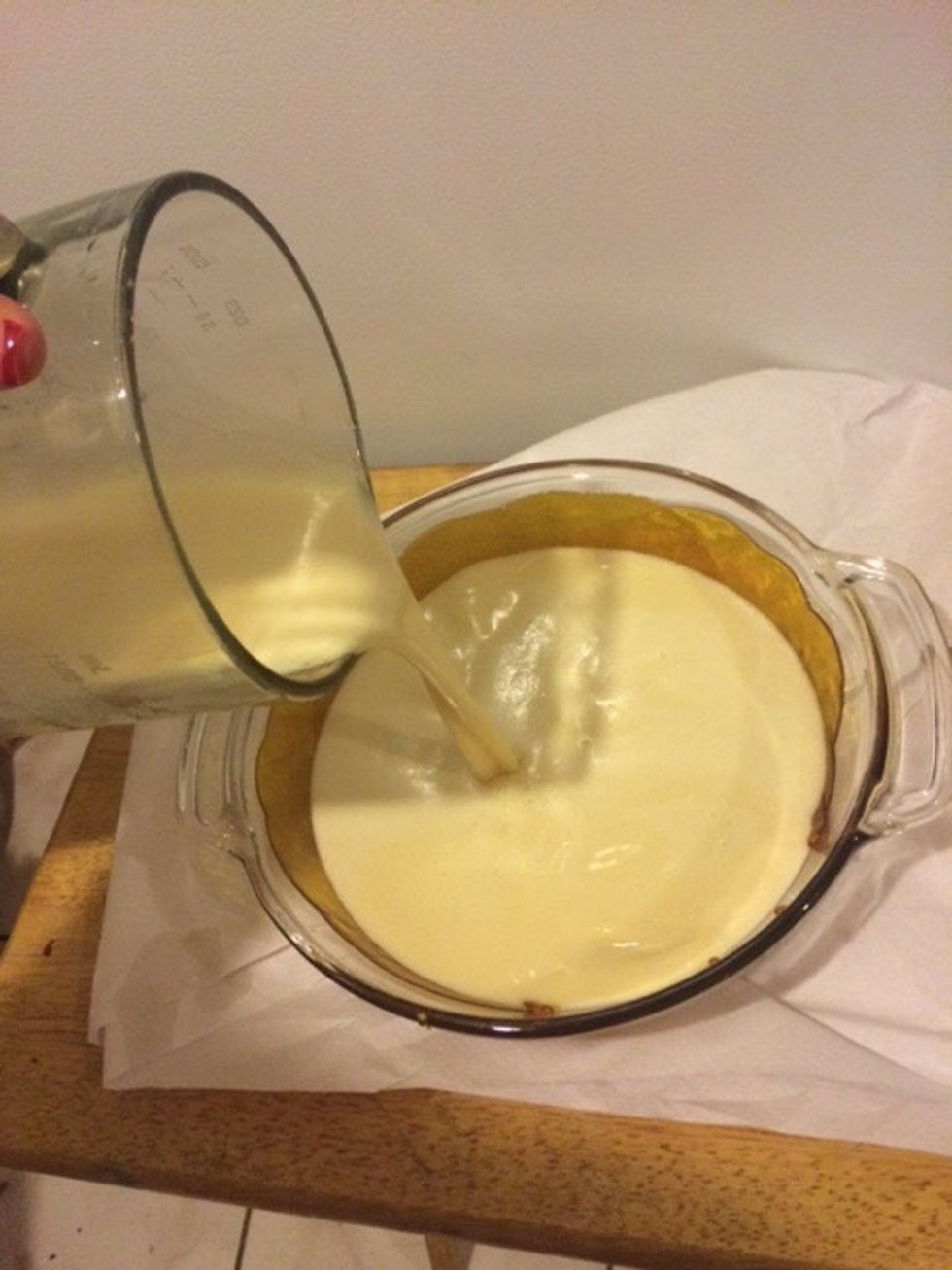 Step 6: Pour flan mixture onto caramel dish\u2026you may hear it crackle\u2026don\u2019t worry, it\u2019s supposed to do that cause of the sugar.