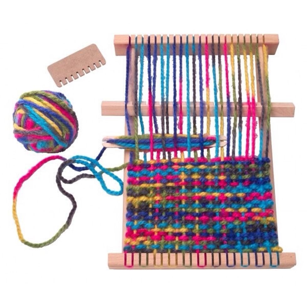 Step 6: Put the wool in the loom very carefully.