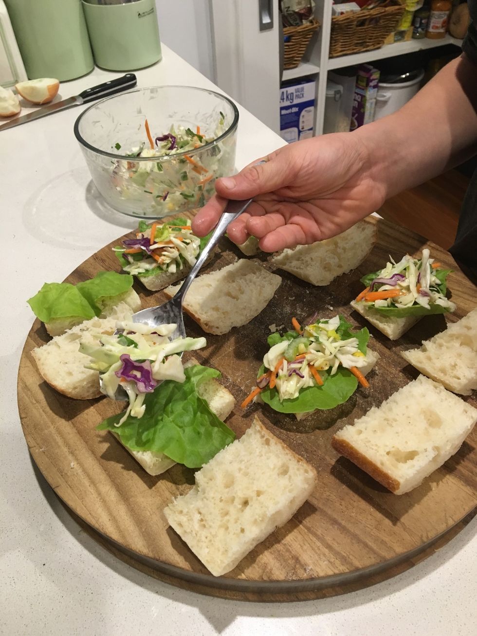 Step 6: To assemble, top each panini base with lettuce.