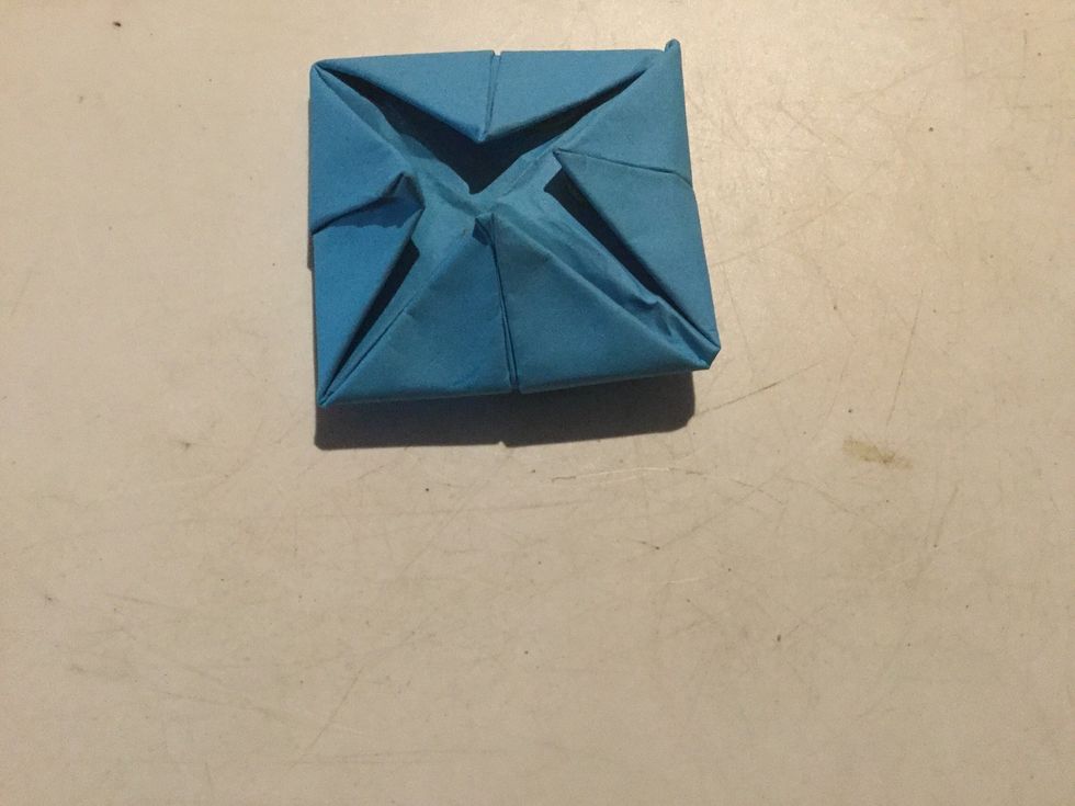 Step 7: Fold the corners in the middle.