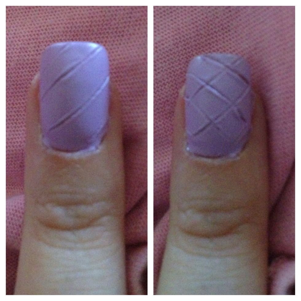Step 7: Gently press flosser into nails in a diagonal pattern like shown above.