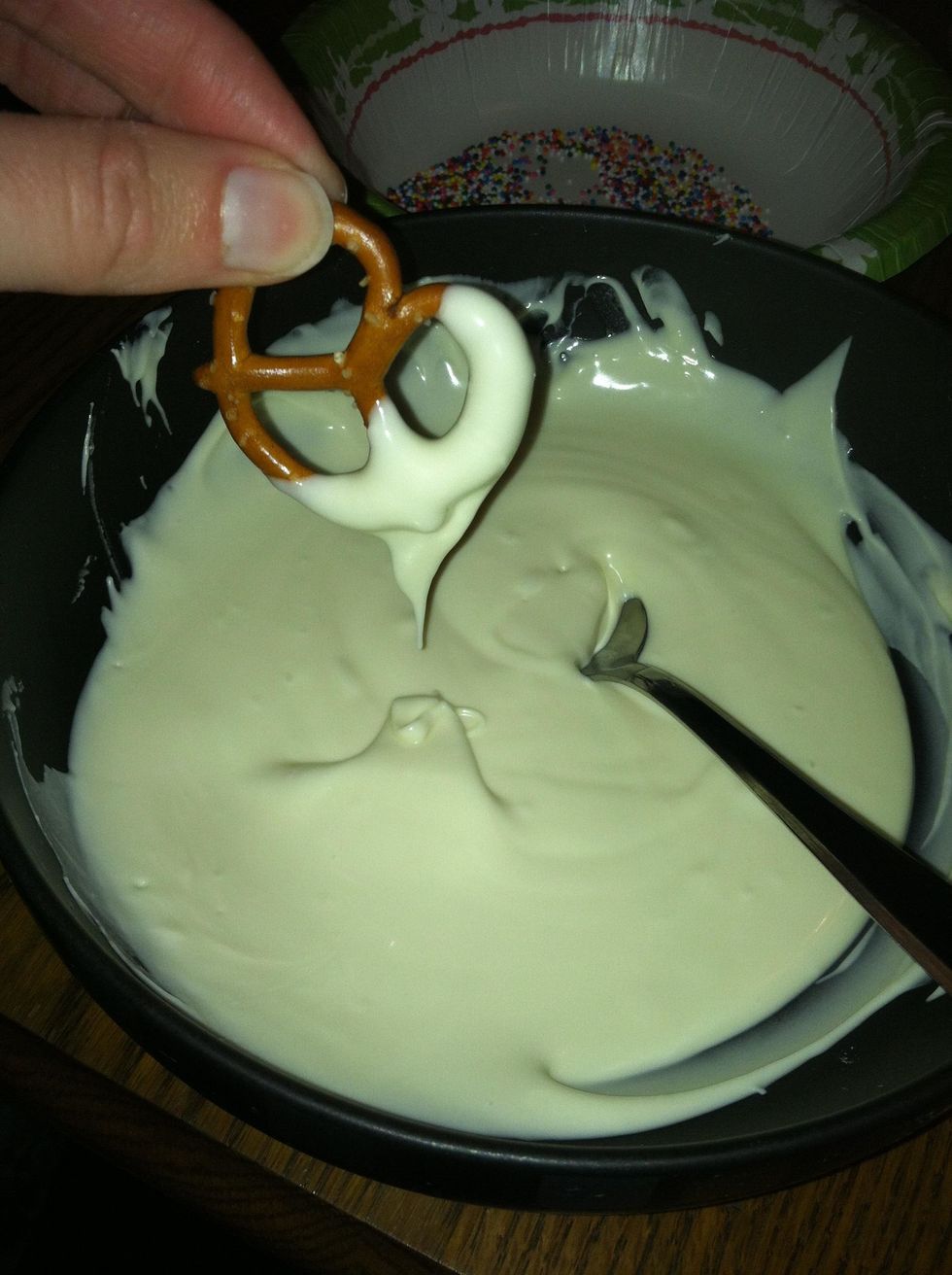 Step 7: Let the extra chocolate fall off of the pretzel.