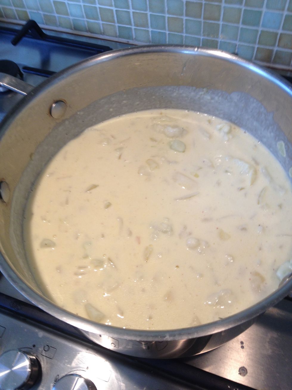 Step 7. Now add the cauliflower and 300g of the cheese. Then season with salt, pepper and nutmeg.