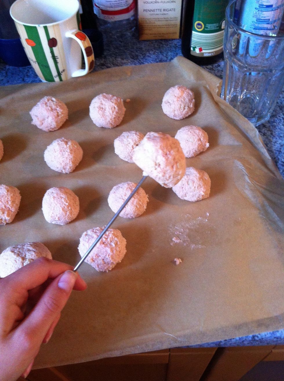 Step 7: Now stick wooden or metal skewers into the cake balls.
