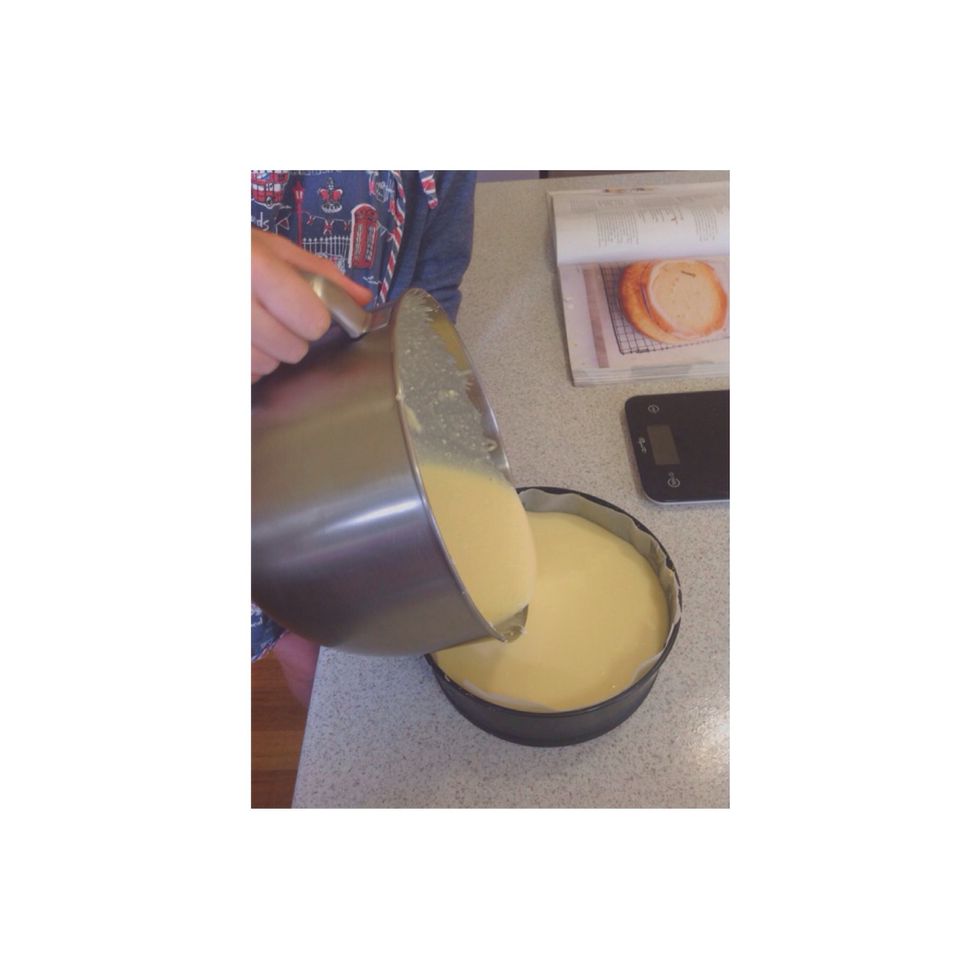 Step 7. Take out the base and tin from the fridge and slowly pour the mixture into it.