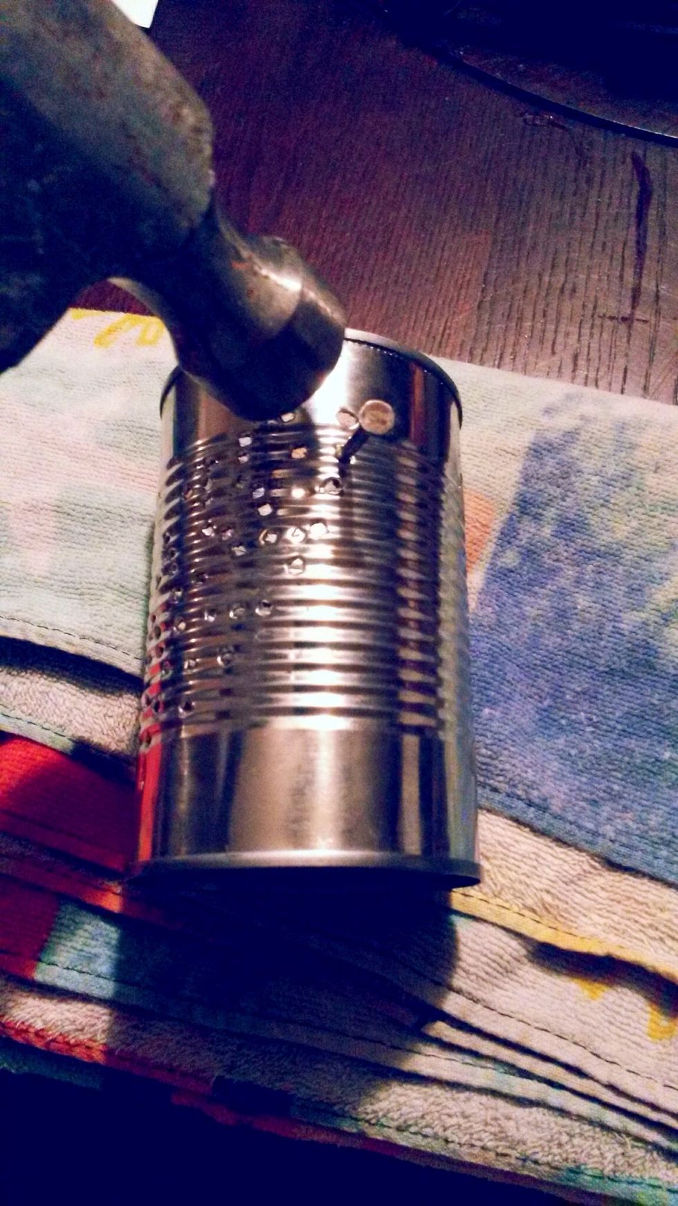 Step 7: Take your hammer and nail and start hammering your design. Make sure you capture every detail of your picture.