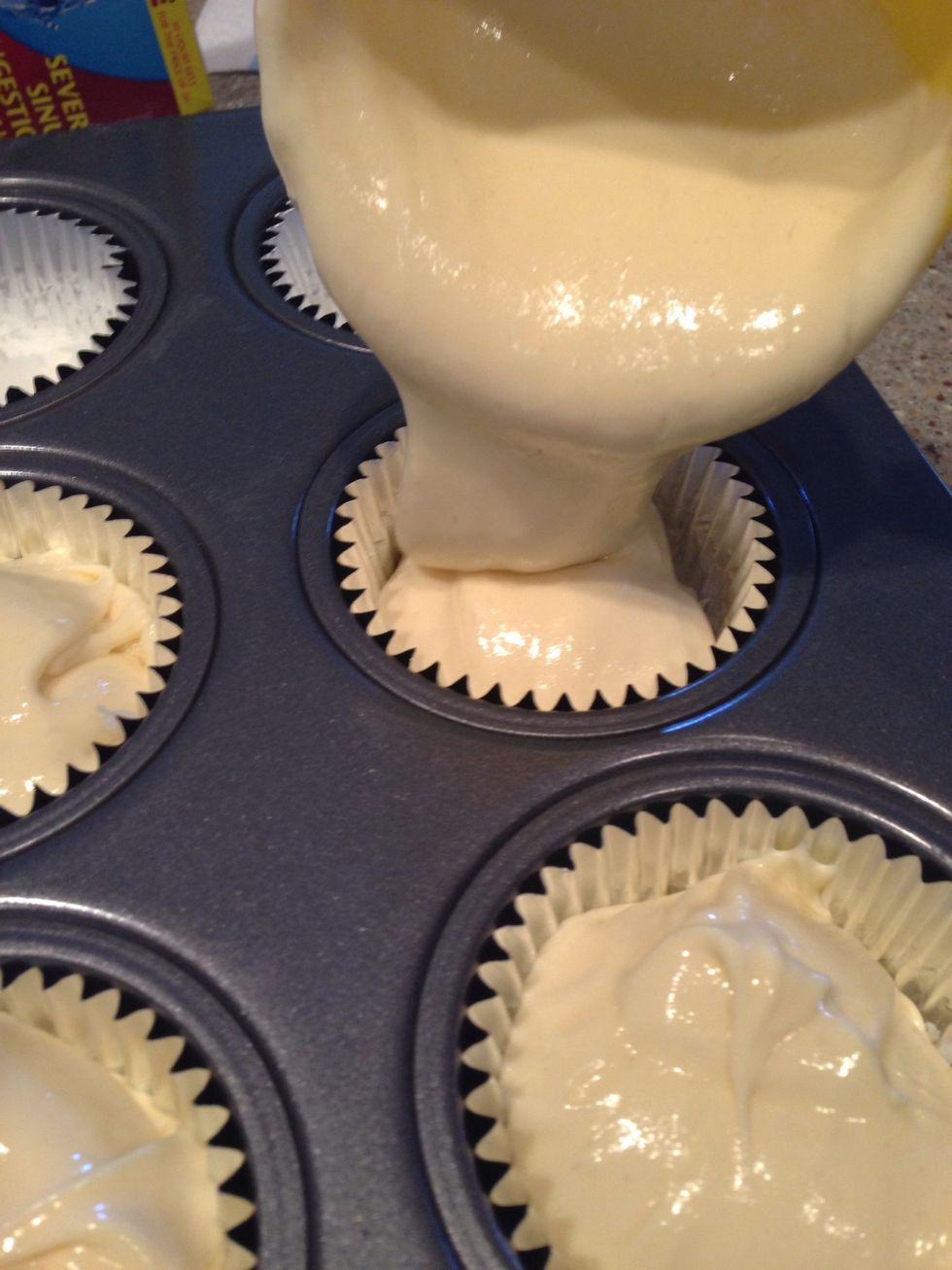 Step 7: using a measuring cup fill each cupcake wrapper 3/4 of the way full (see above).