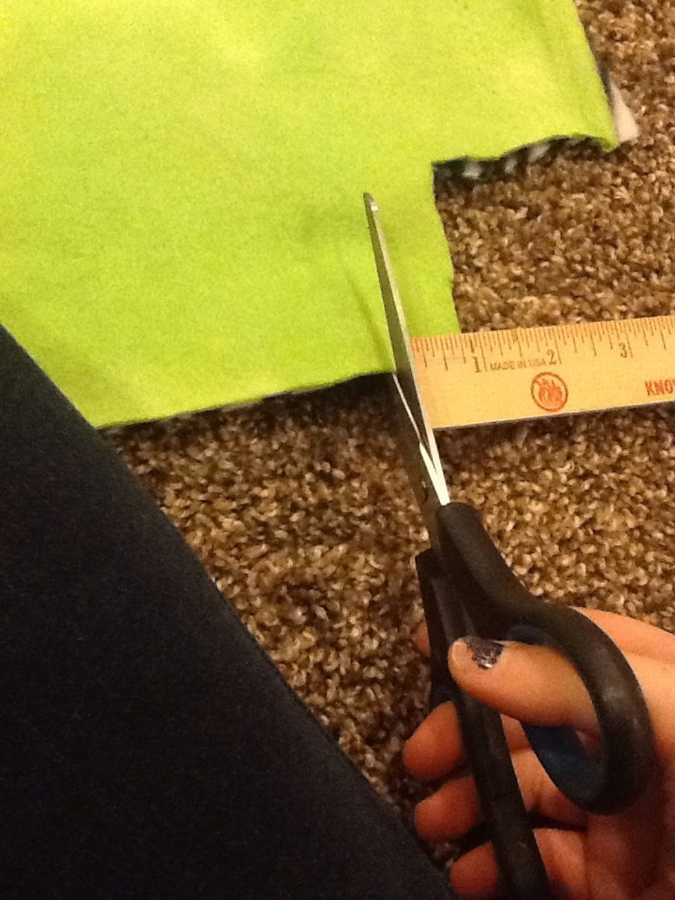 Step 8-Begin to cut your strips for the tie strips for the blanket stop at the cut of the square you had made before so then you'll have a perfect even blanket