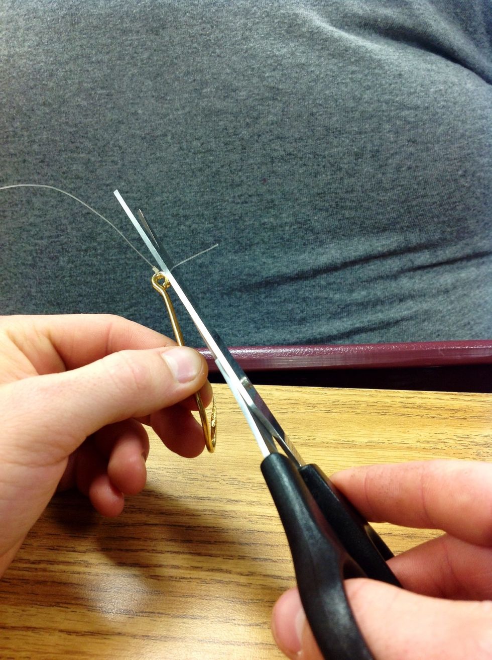 Step 8: Cut off excess of tail end of line