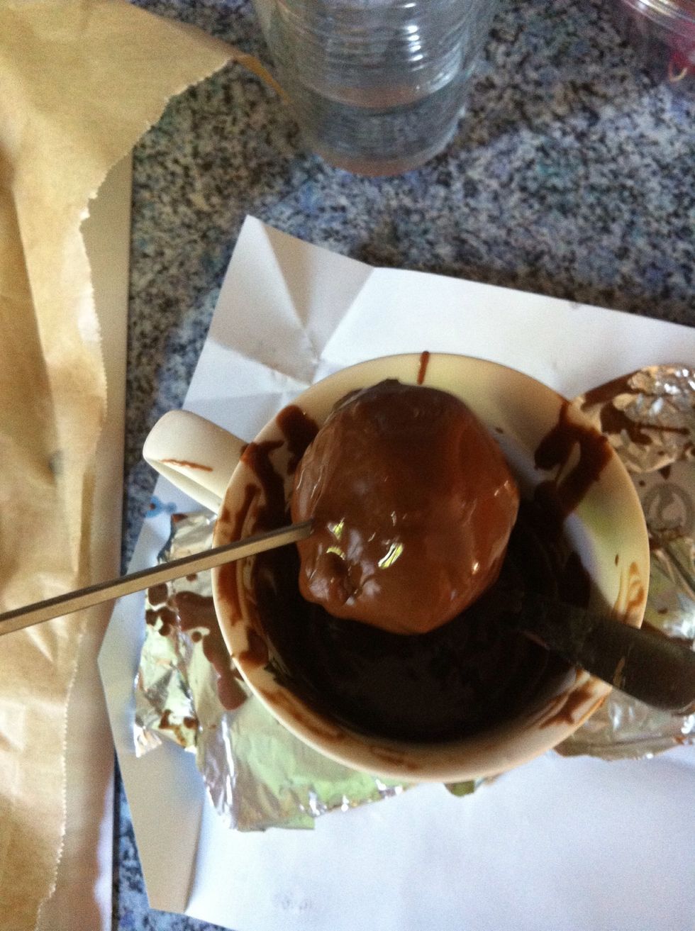 Step 8: Dip them into the chocolate so they're completely covered.