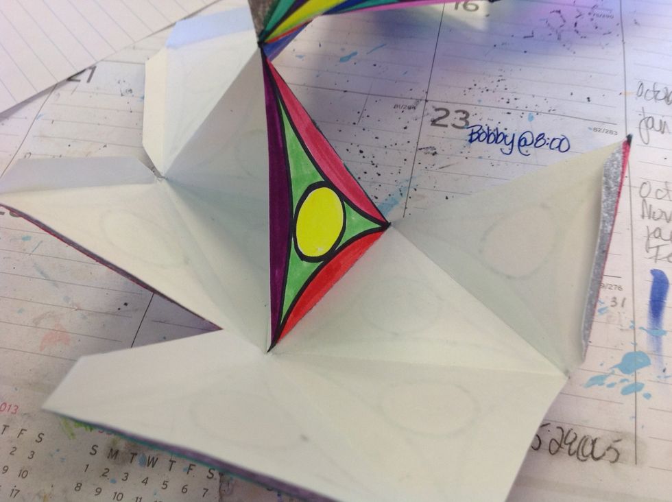 Step 8: Fold each section together to create a pyramid shape. Make sure that each part is stuck together well before going on to the next part.