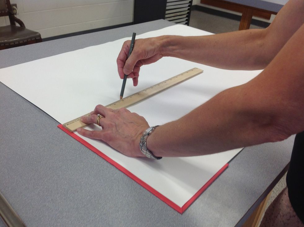 Step 8: Measure out the height of your book on a long sheet of paper. The height of your page should be slightly smaller than the book height.