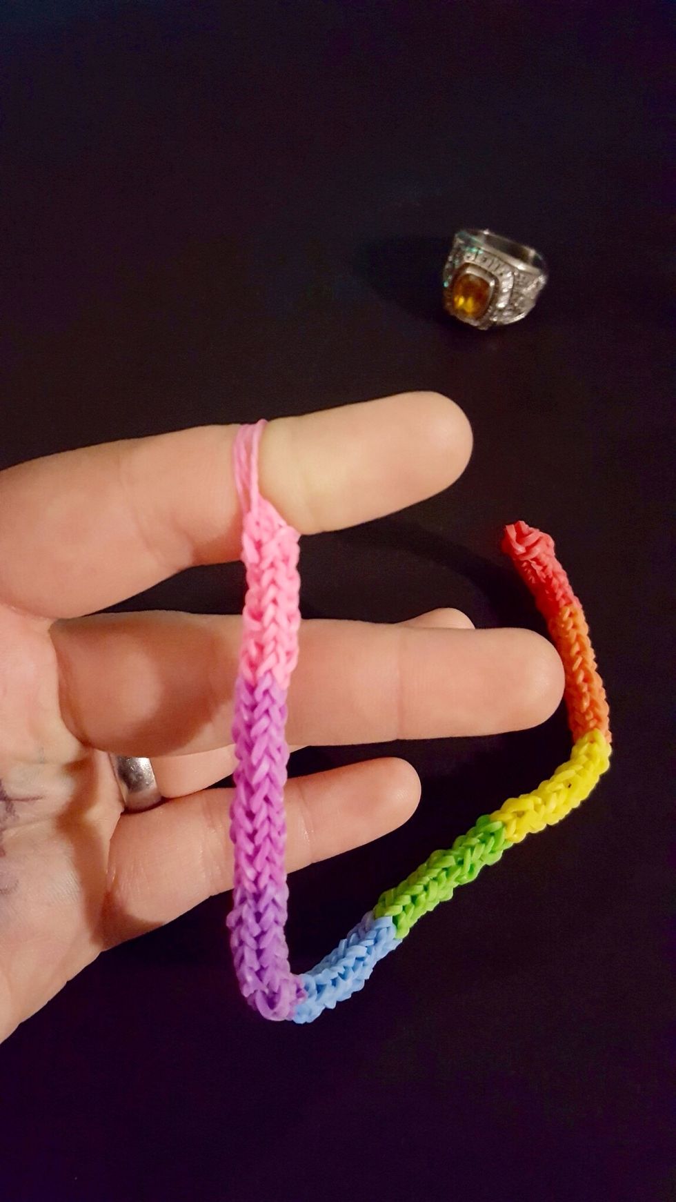Step 8: Once at desired length, collect all 4 corners onto 1 finger.