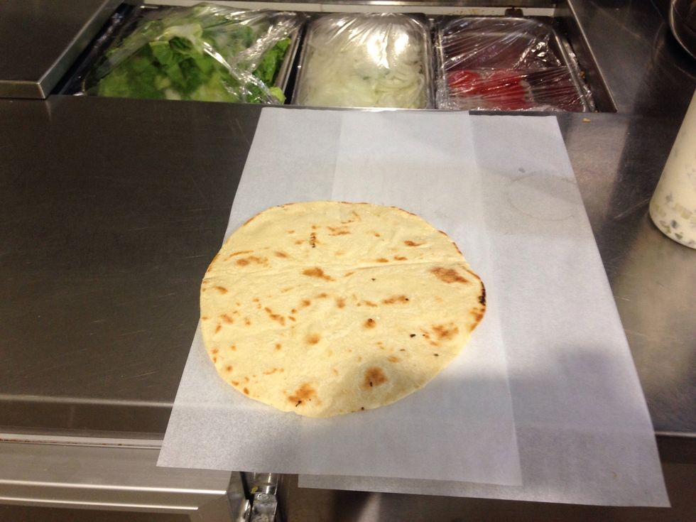 Step 8: Place pita bread on the preparation bench/ area.