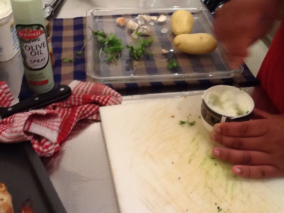 Step 8. Put as much yogurt as you want in a cup and add chopped garlic and parsley