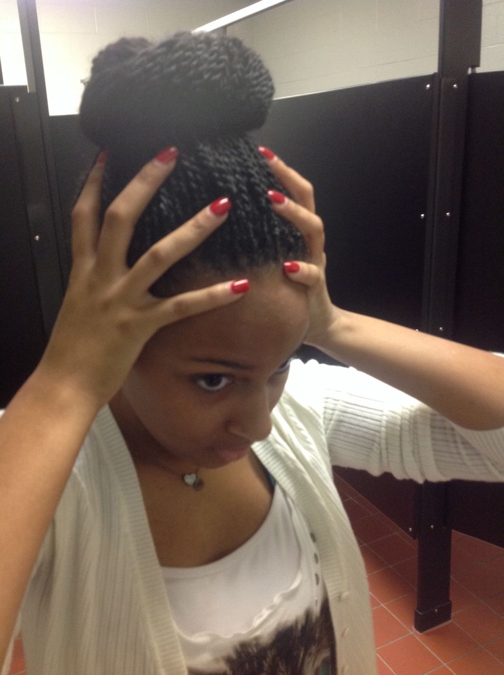 Step 8: Shake your head, using your hands, to make sure it's secure.