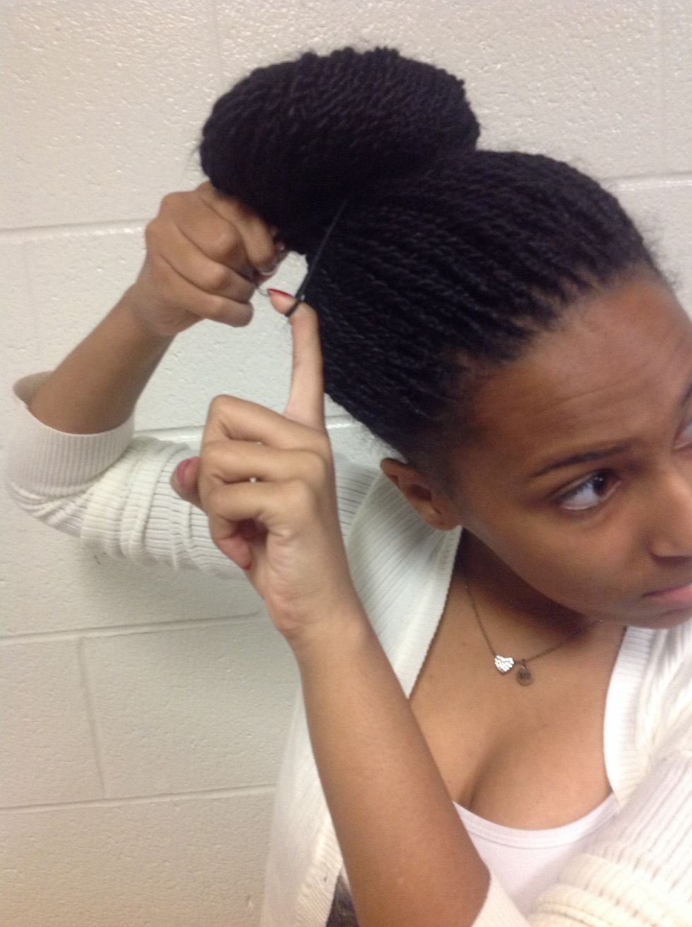 Step 8: Tuck the of your head into your ponytail.