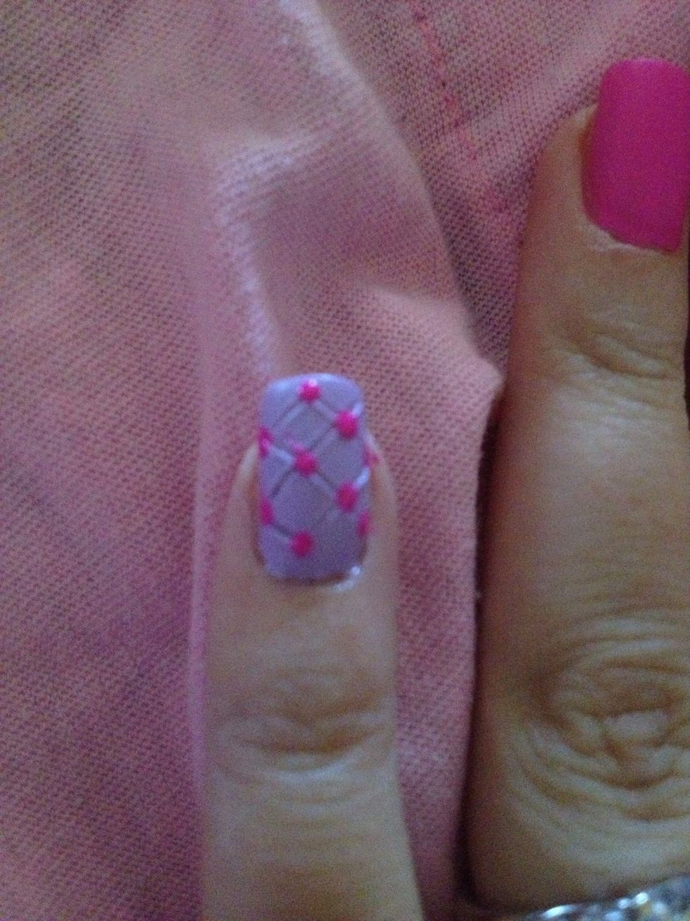 Step 8: Use Pink nail polish and dotting tool to place polka dots where lines intersect.