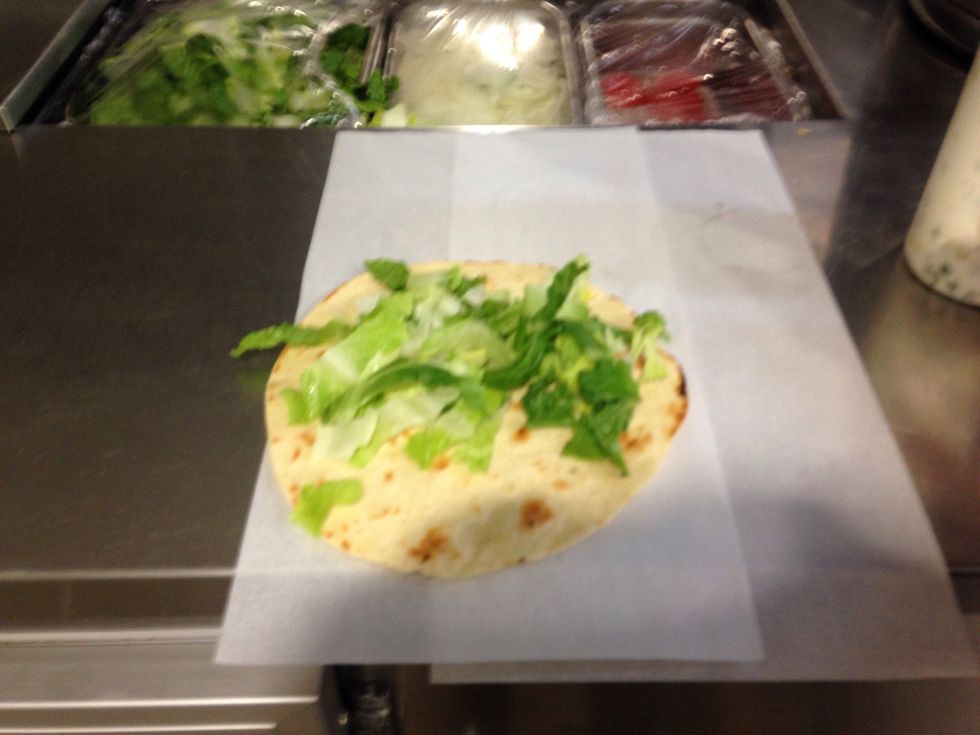 Step 9: Add topping of your choice, in this case lettuce.