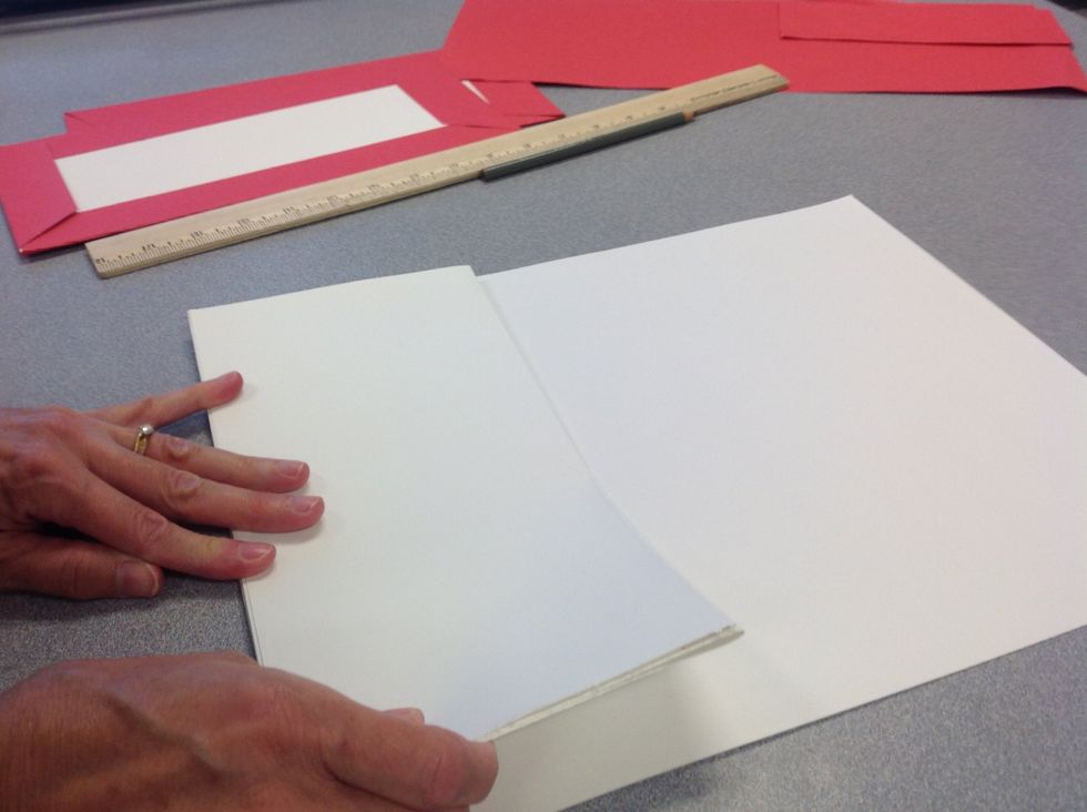 Step 9: Fold your length of paper into an accordion stack that fits inside the book covers.