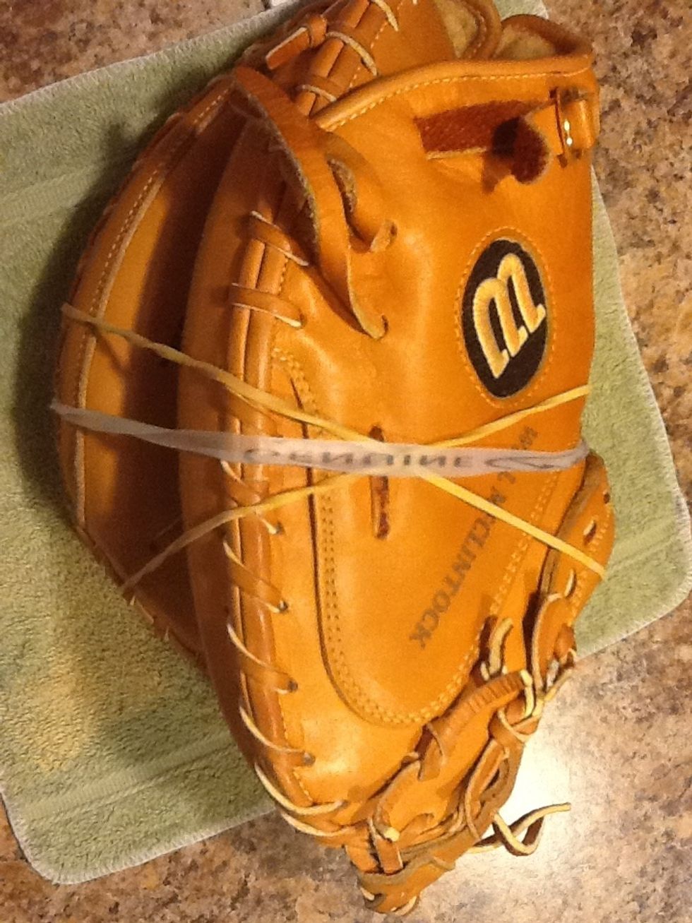 Step 9.) Now that your done place the glove on the same rag and keep in a cool, spot where glove can absorb the moisture for 2-3 days.