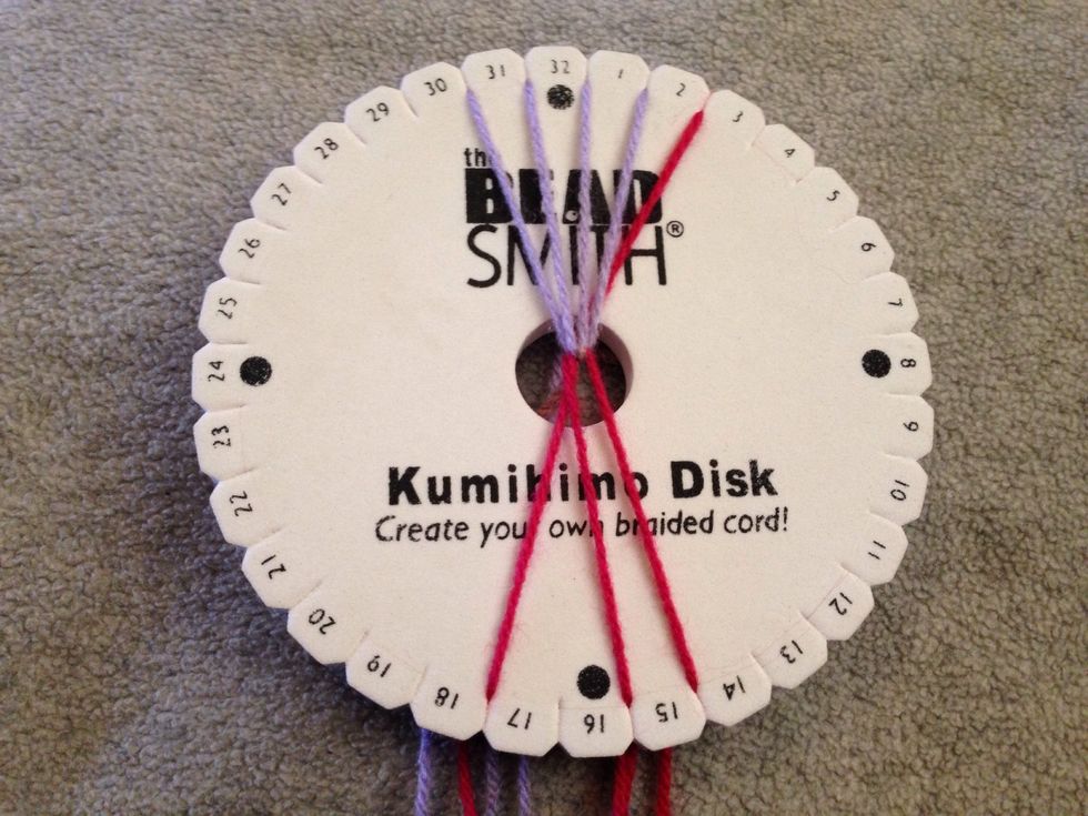 STEP 9 - This is the most important part of the braid to keep it together, move thread 29 down and across to slit 15.