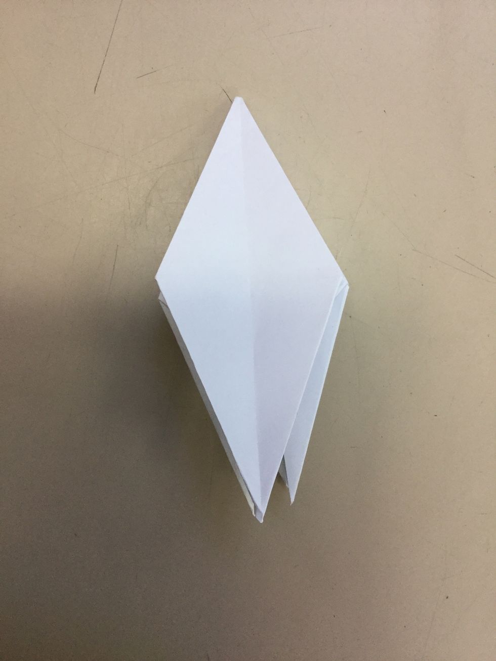 Step 9: Use your hands and flip one of the edges over.