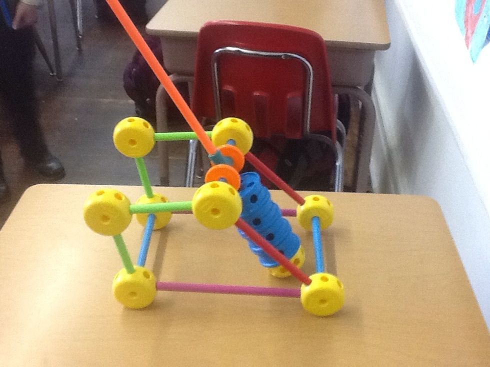 Step five, now add the blue wheels