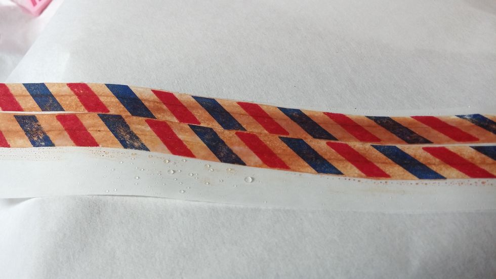Step Five: To distress the tape further I spritzed with water to activate the stain.
