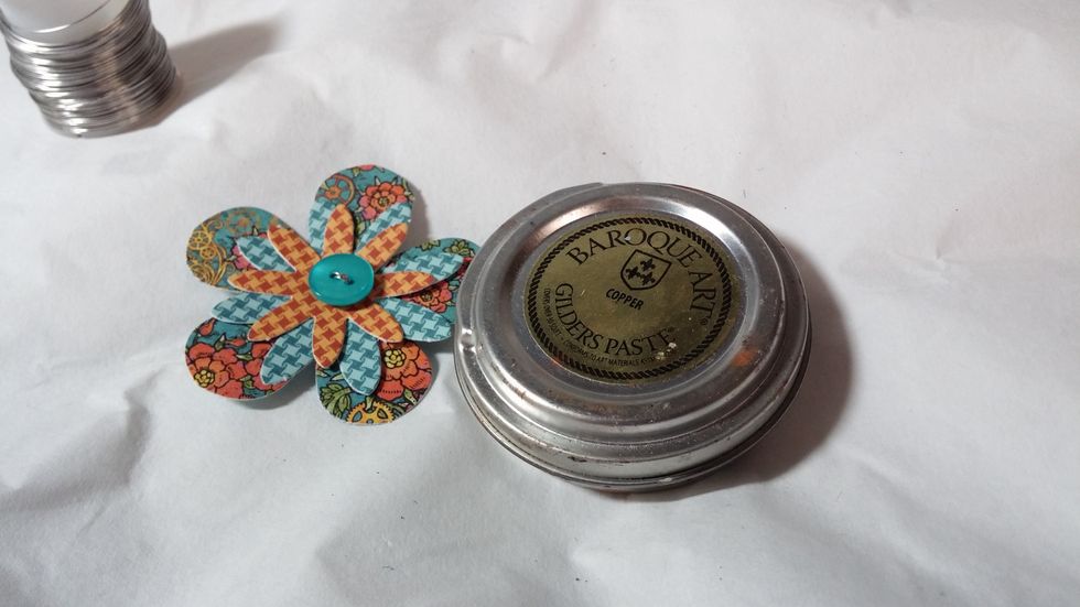 Step five: Use gilders paste to age and distress the flower.  I also crumple the petals at this time to add texture.