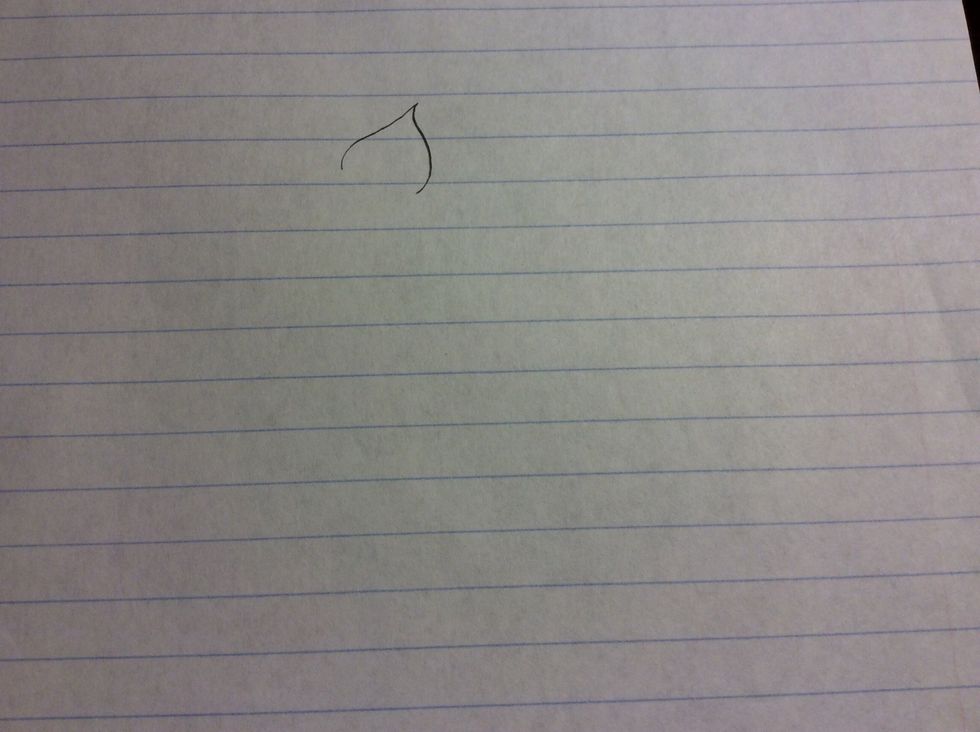 Step one is to draw a petal form with your pencil.