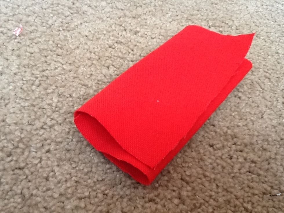Step one is to fold the big piece of fabric into thirds.