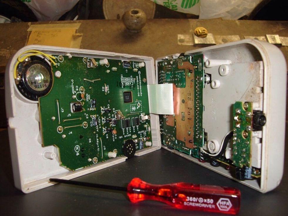 step one is to remove the screws. There are six triwings on the back of the DMG. Four are visible, and two are hidden under the battery compartment. make sure you don't loose these screws.