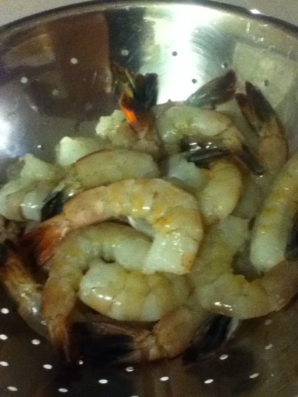 Step one: shrimp. I took the shells off but left the tails on for a handle. Don't forget to save those shells in a ziplock bag in your freezer, you can use 'em later to make a killer shrimp stock.