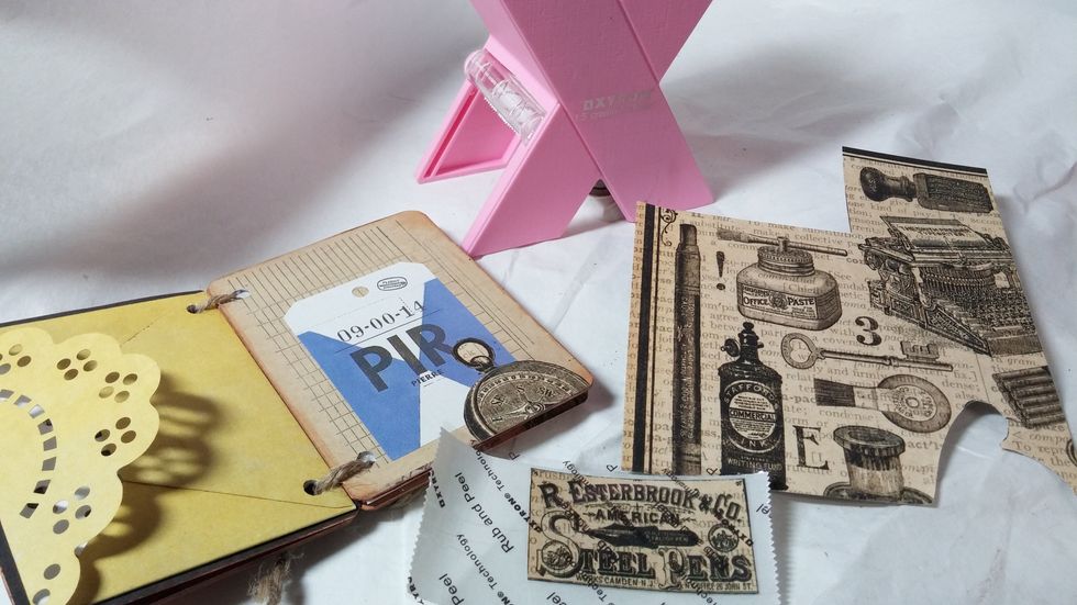 Step Seven: Start to decorate your book. Use the Xyron 1.5" sticker maker to achieve perfect adhesion!