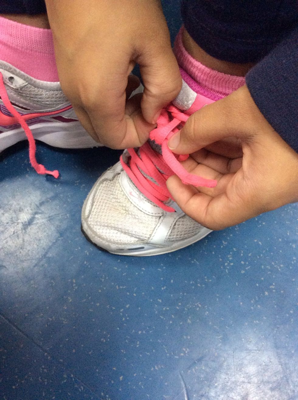 Step six, at last put one bunny ear through the whole. And pull.