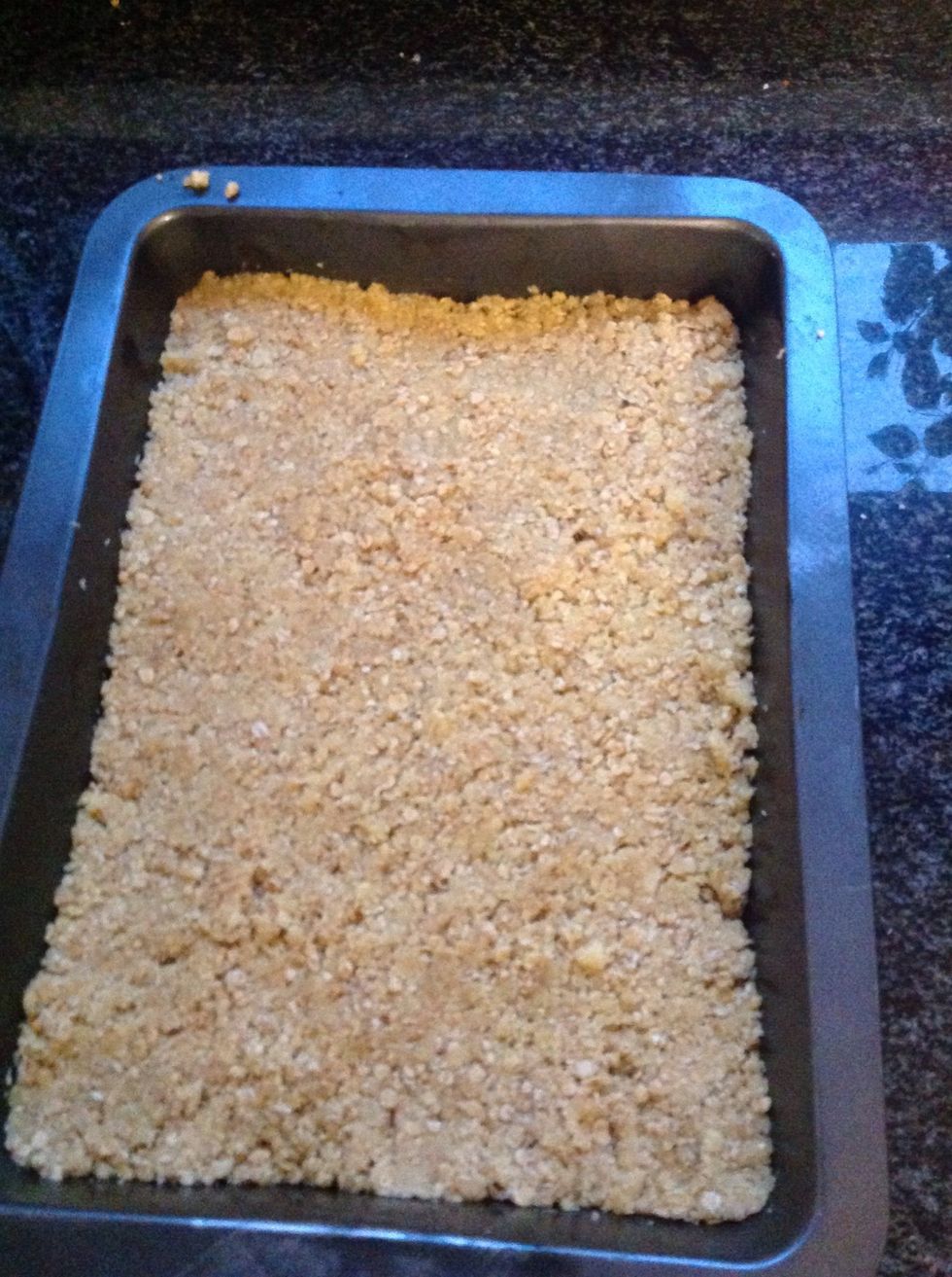 Step six: Place the ingredients in the greased baking pan and press down gently