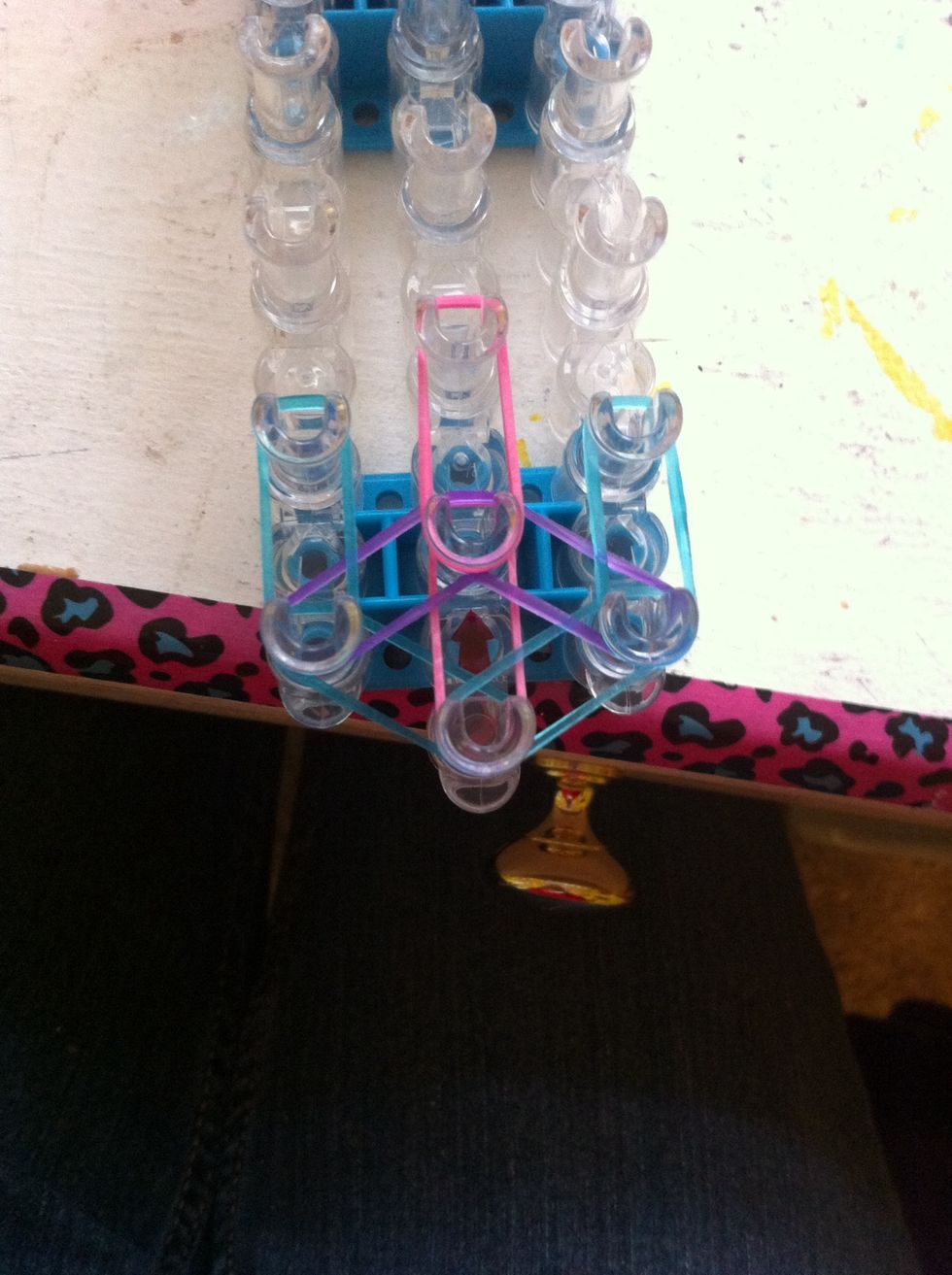 Step six-Put two blue bands on either side and a pink in the middle