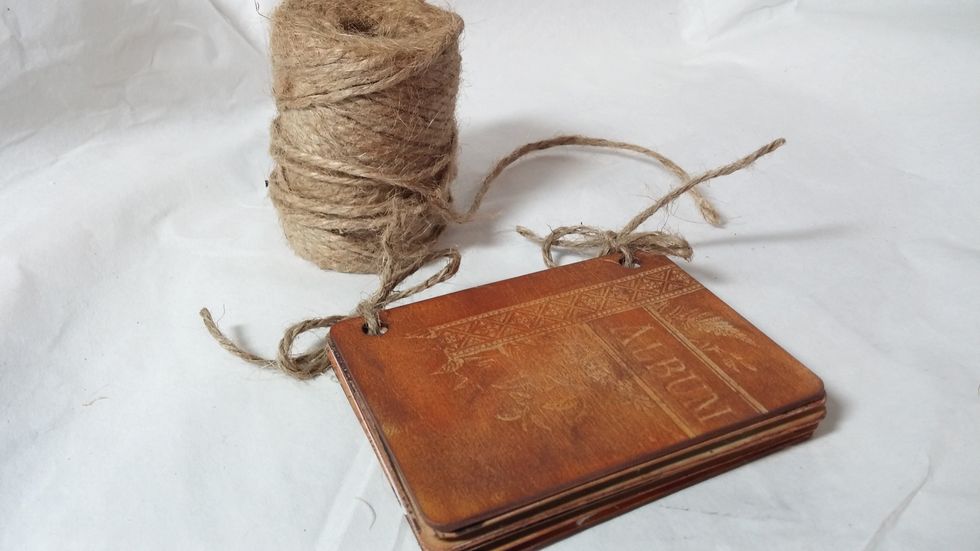 Step Six: Thread the twine through your pages and tie in a knot or a bow.