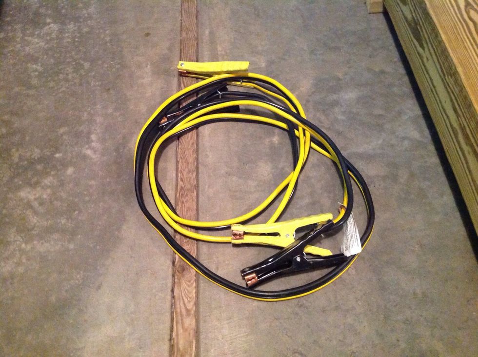 Step Three: Get out a set of jumper cables from one of the cars. (Notice the two different colors.)