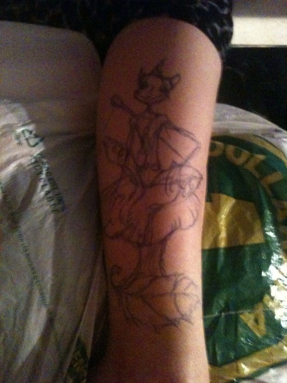 Step three is applying your artistic interpretation to the skin using pens etc. this is even less detailed then the sketch I drew. Most of it will disappear while tattooing anyhow.