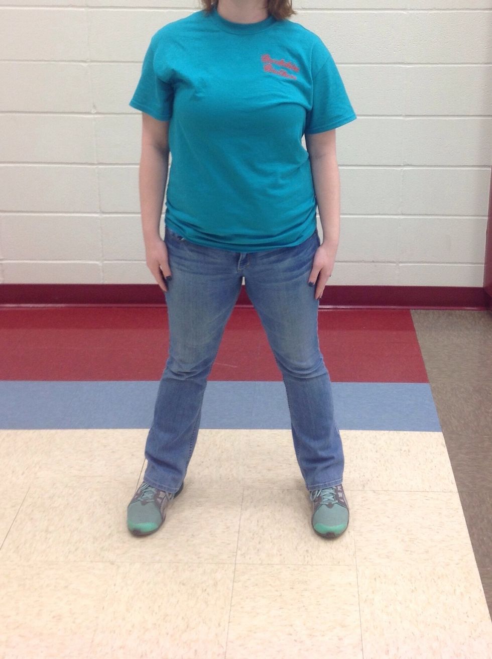 Step to the right, with your right foot so your feet are shoulder width apart.