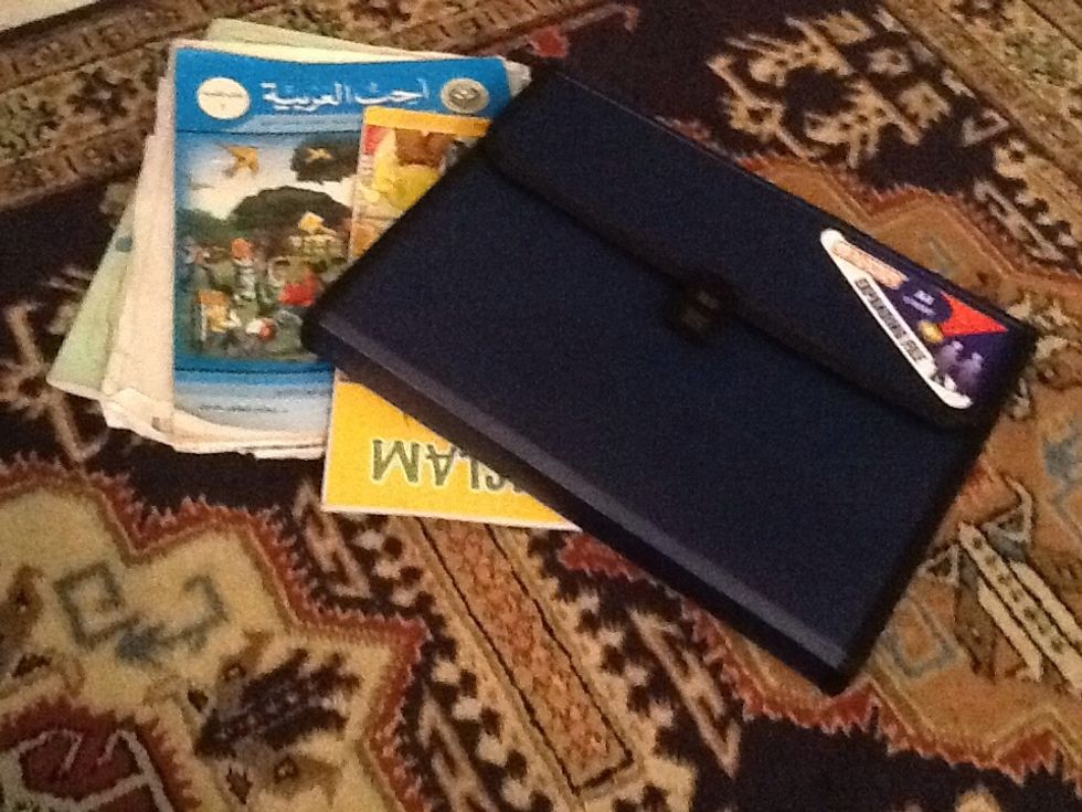 Step two, Next get your homework and folder
