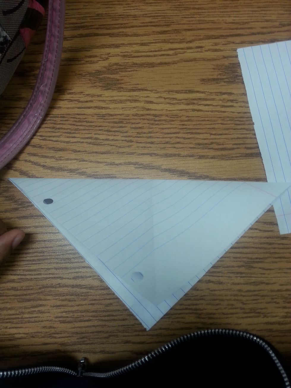 Step4: you see it's folded, now open the triangle and fold it down the other side, when you open it now you should see four triangles