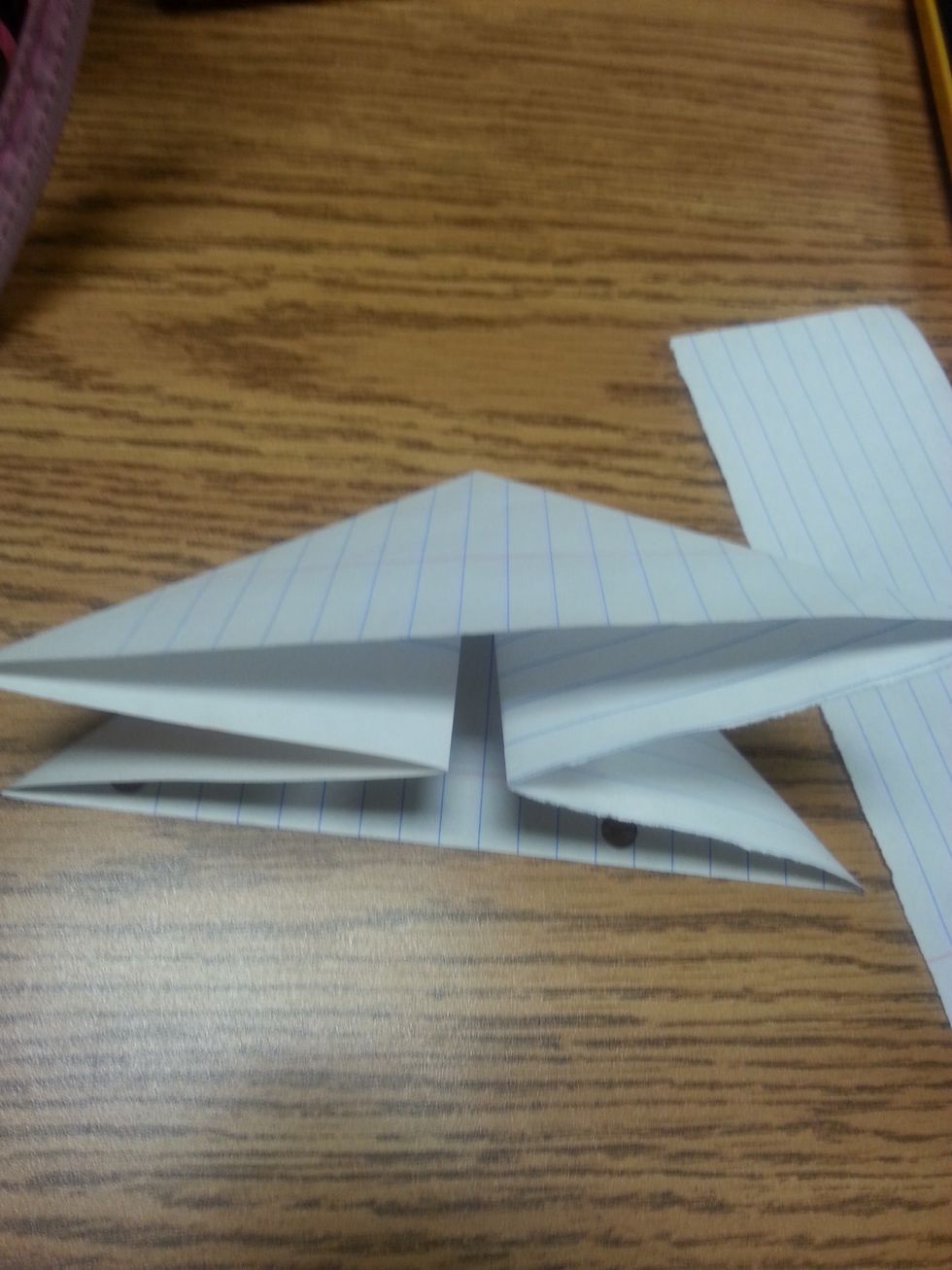 Step5: take any of the side of the four squares and push them inward so now your back to one triangle