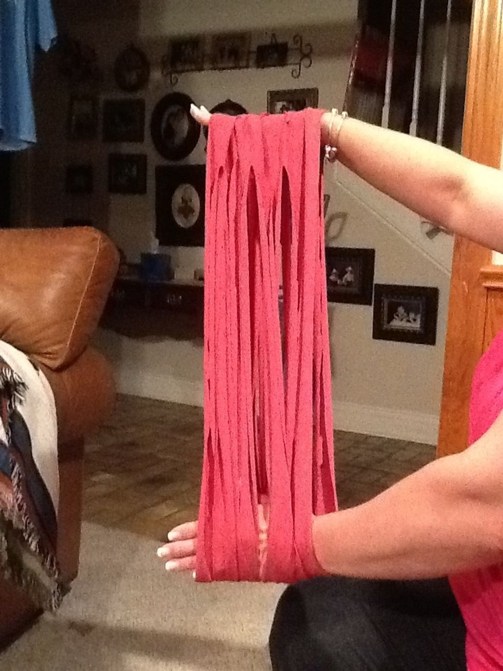 Step5: Using your hands, stretch the material. You will be suprised at how much the material stretches. This step also takes care of those jagged edges when you cut your strips.